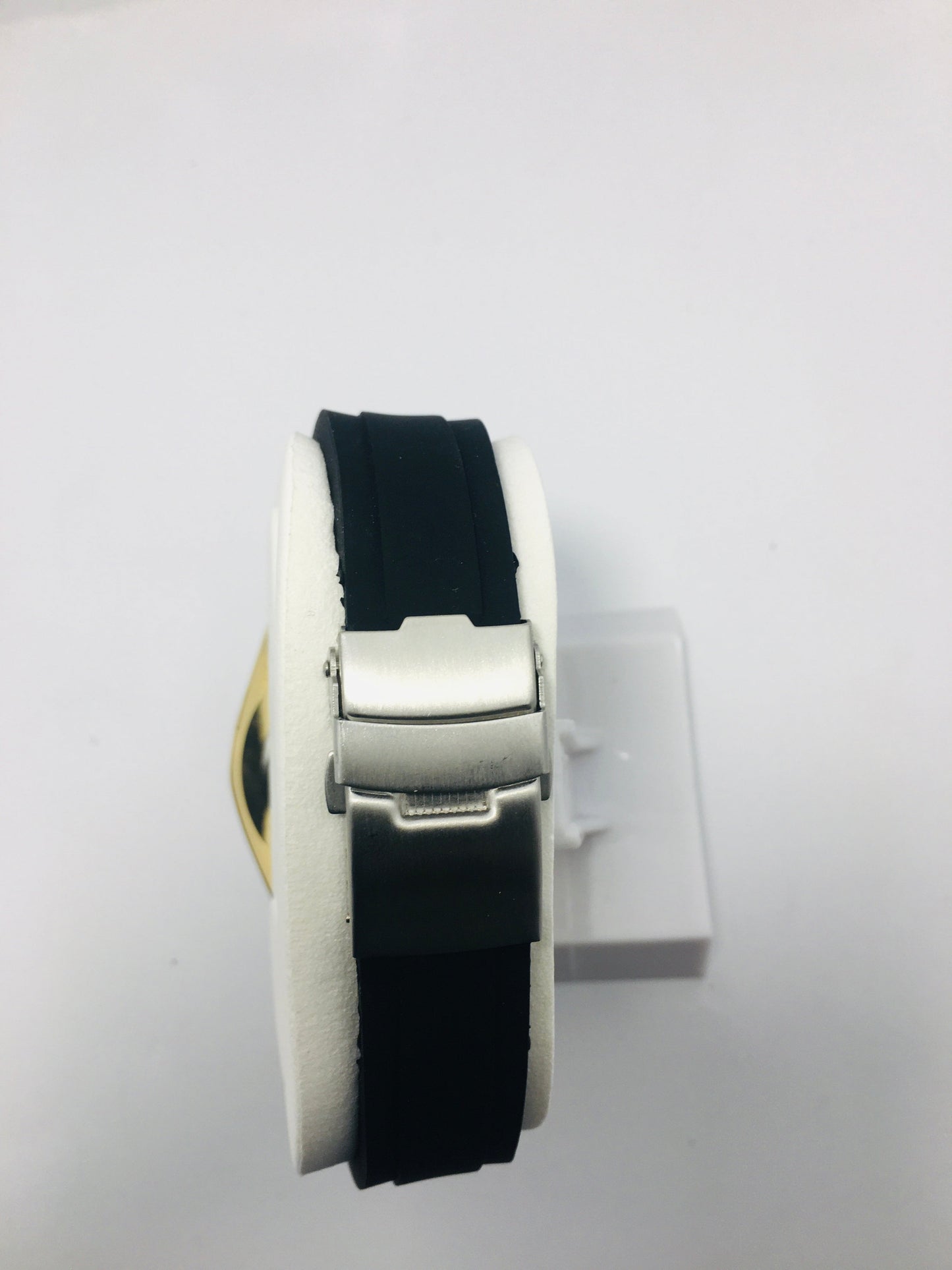 Mitina Movement diver-style watch with a black dial, gold-colored accents, a rotating bezel, and a date window. Rubber strap black